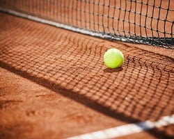 Clay court and tennis ball.jpg