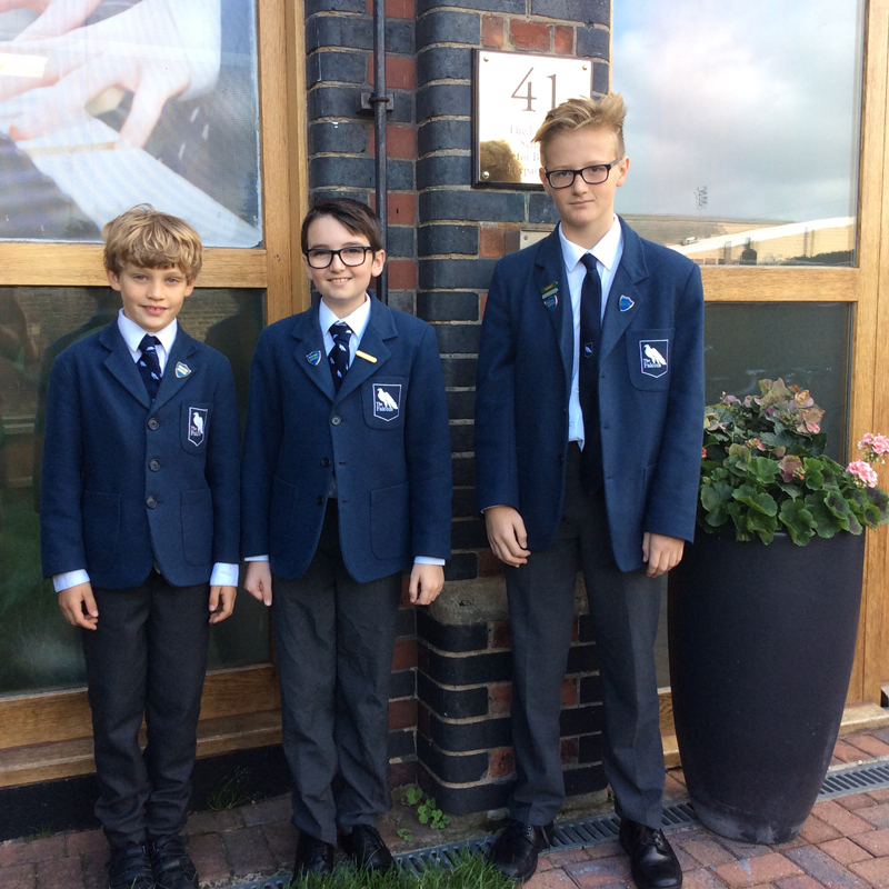 Left to Right, Tristian D (9), Sean D (11) and Callum S (12) proudly wearing their badges